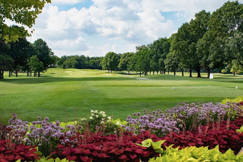 photo of arrowhead golf club wheaton illinois with colorful flowers in the foreground